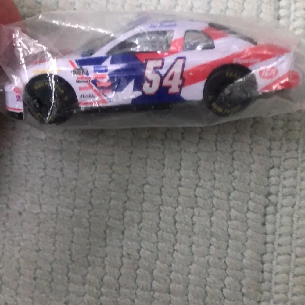 NASCAR die cast toy Monte Carlo Jason Keller #54 car featuring IGA logo. Vintage